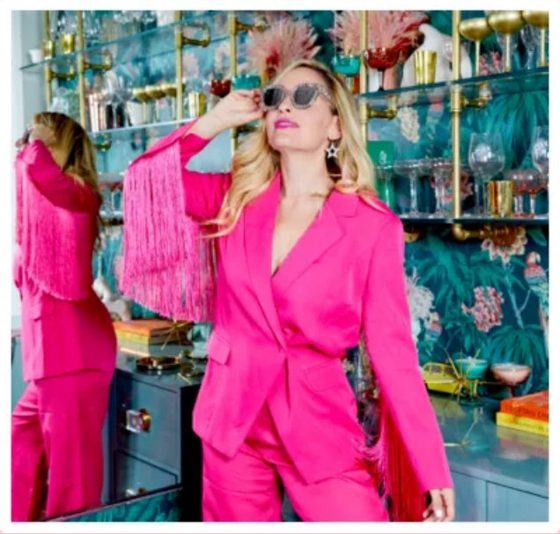 Jen Glantz in a pink suit and sunglasses